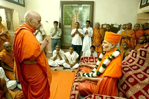 Swamishri engaged in darshan in the sacred room of Shastriji Maharaj 014-004f.jpg