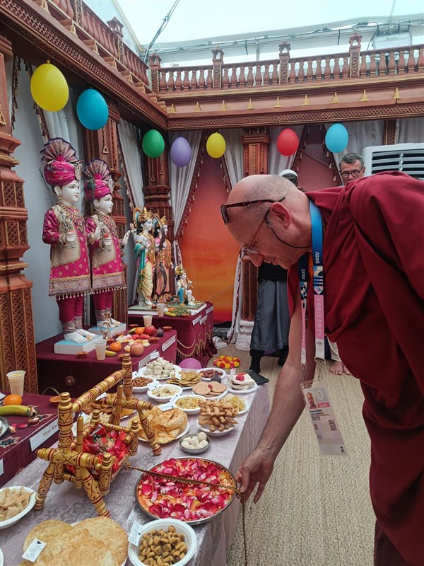 A Buddhist monk participates in the Shri Krishna Janmashtami celebrations