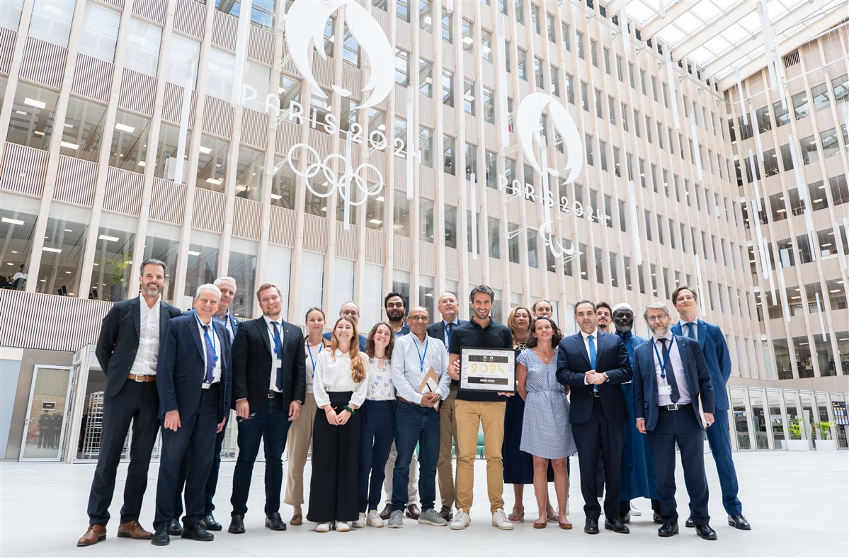 Tony Estanguet (centre, with plaque), President of Paris 2024, with representatives from the Multi-Faith Centre, including BAPS volunteers