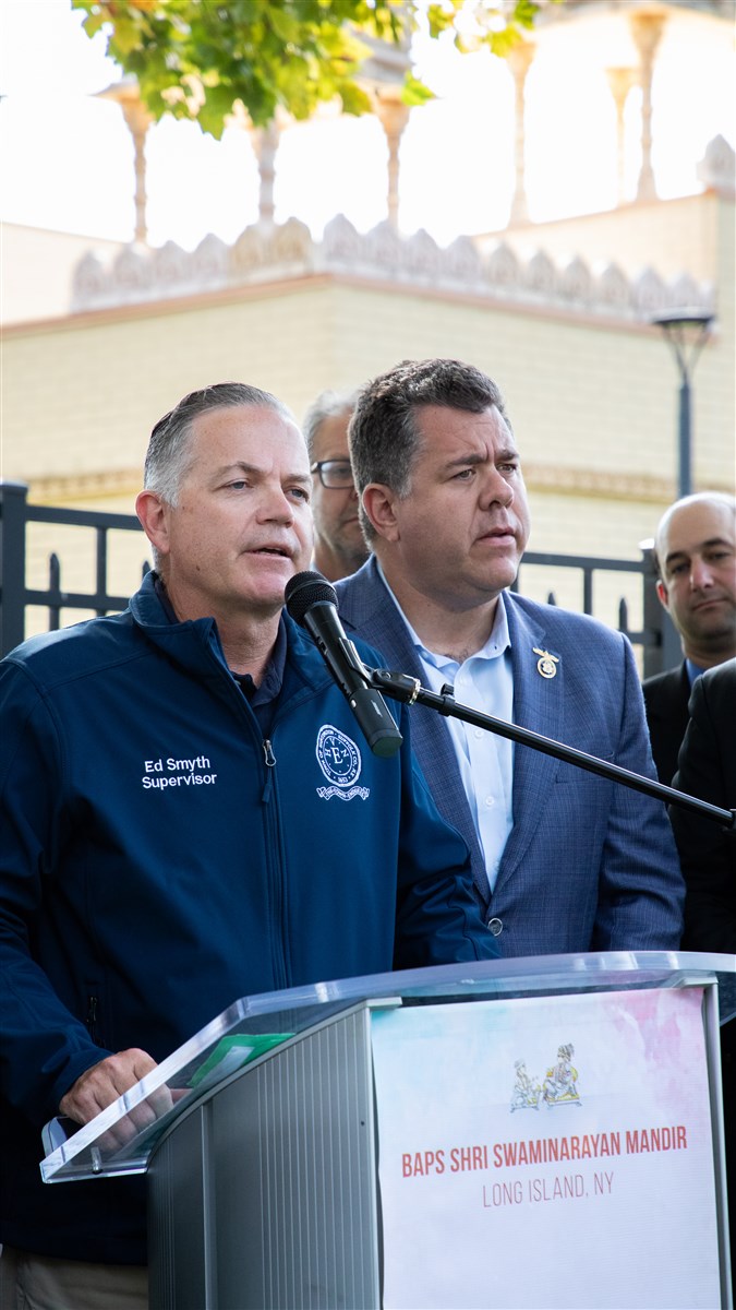 Ed Smyth, Town of Huntington Supervisor, stands in solidarity with the community.