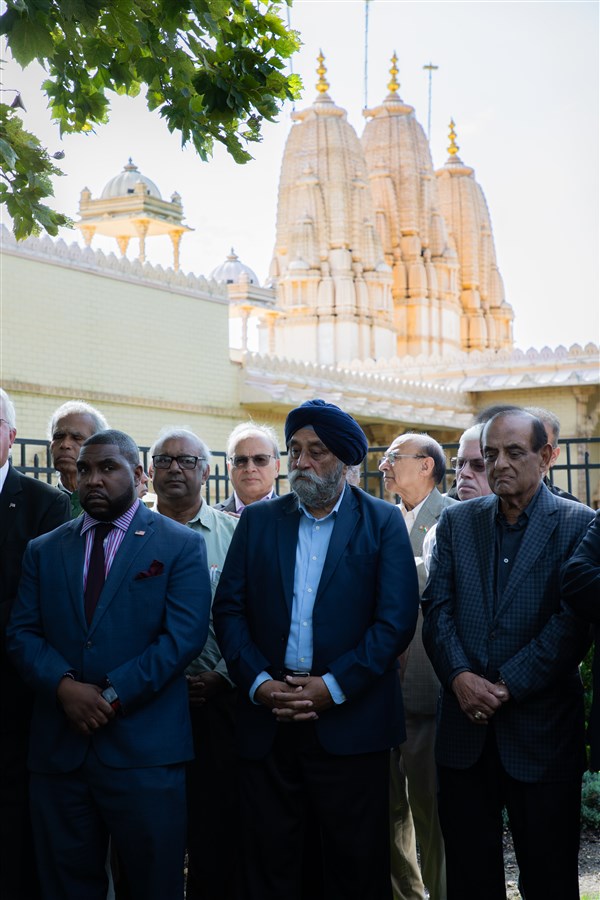 Community members gather in solidarity to pray for peace and healing.