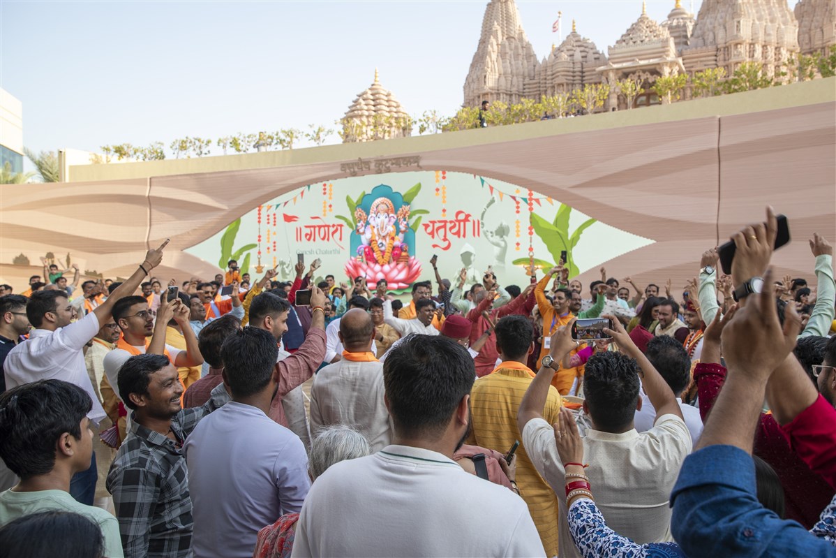 Devotees dance and rejoice during the Ganesh Visarjan procession.