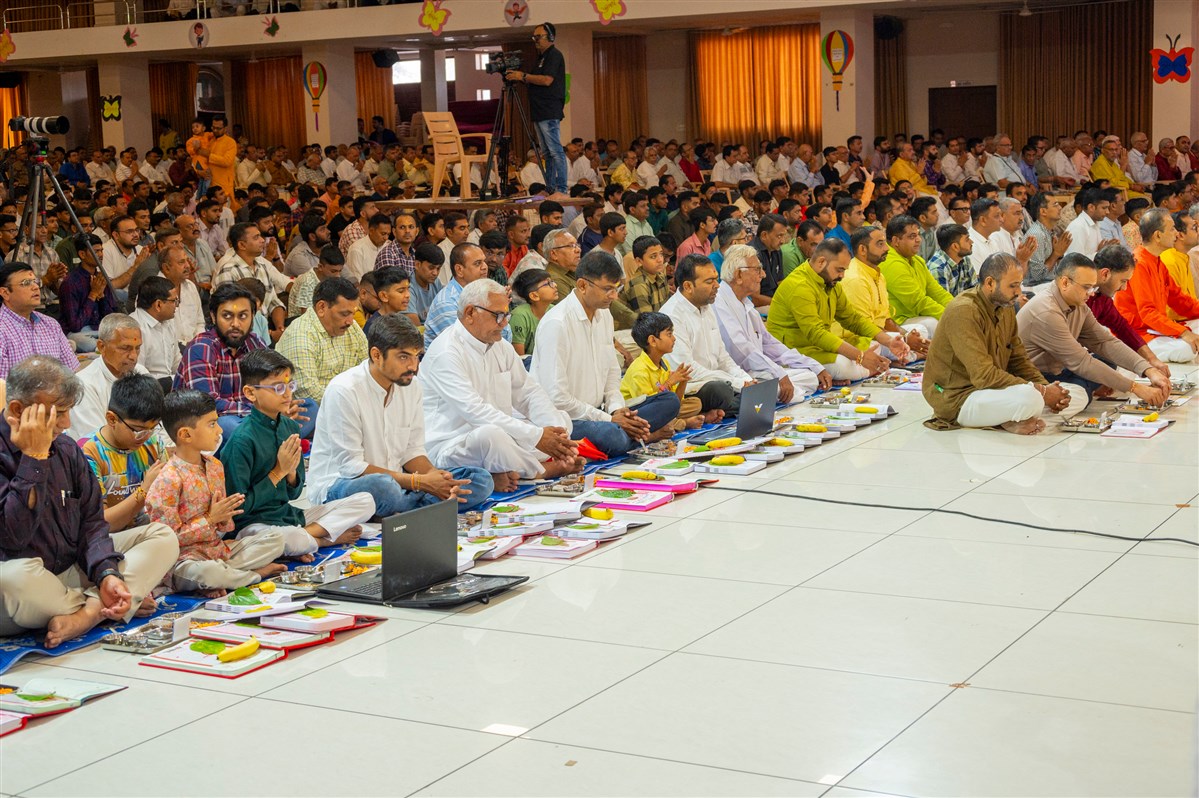 Devotees participate in mahapuja rituals