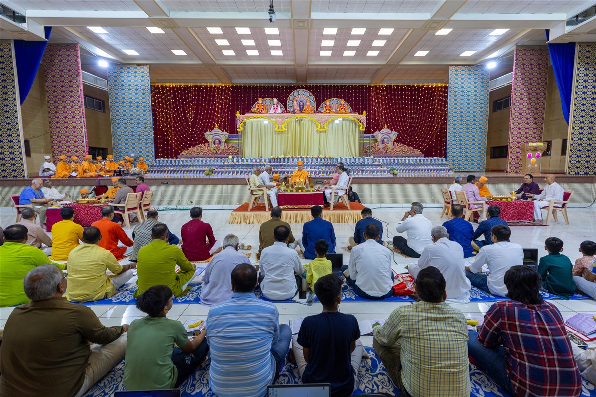 Devotees participate in mahapuja rituals