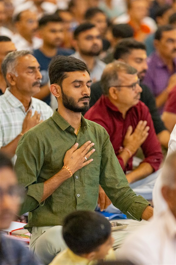 Devotees participate in mahapuja rituals