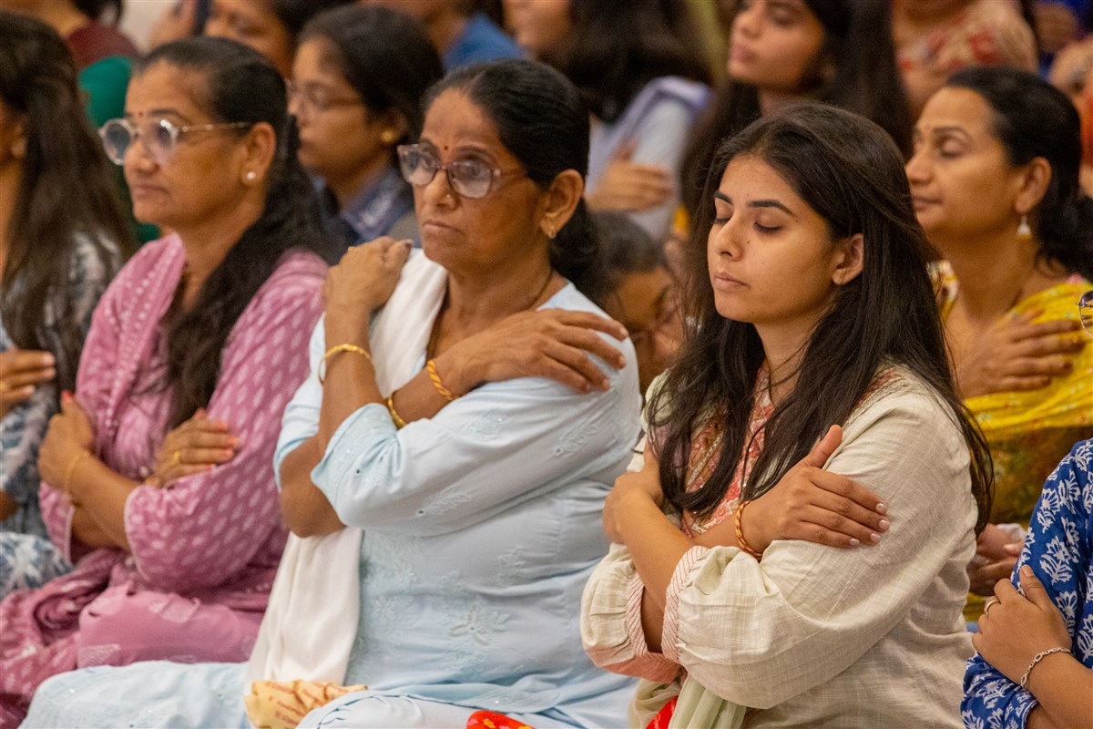 Devotees participate in mahapuja rituals