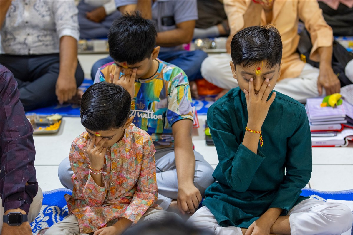 Children participate in mahapuja rituals