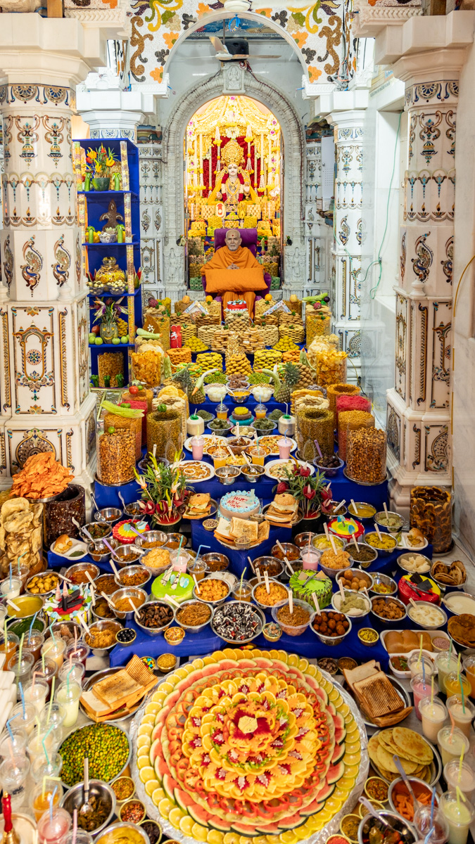Swamishri amid the annakut in the main mandir