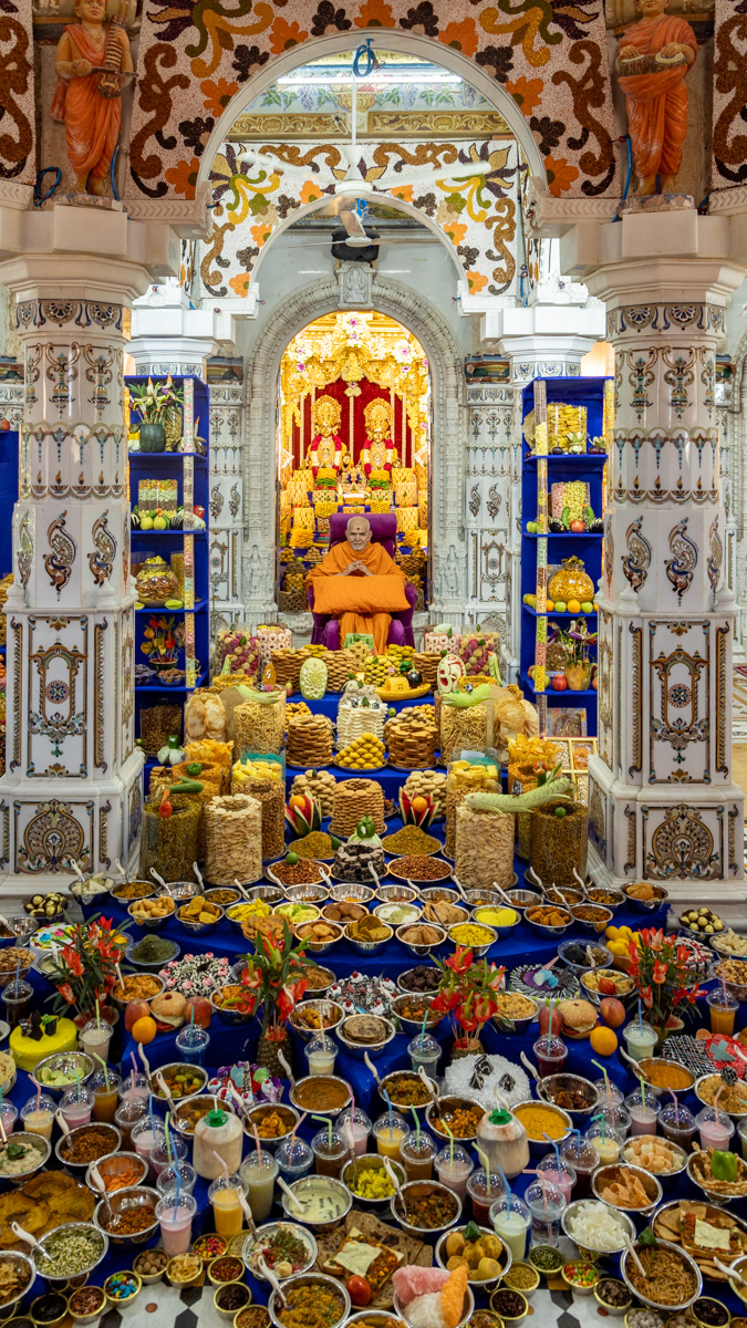 Swamishri amid the annakut in the main mandir