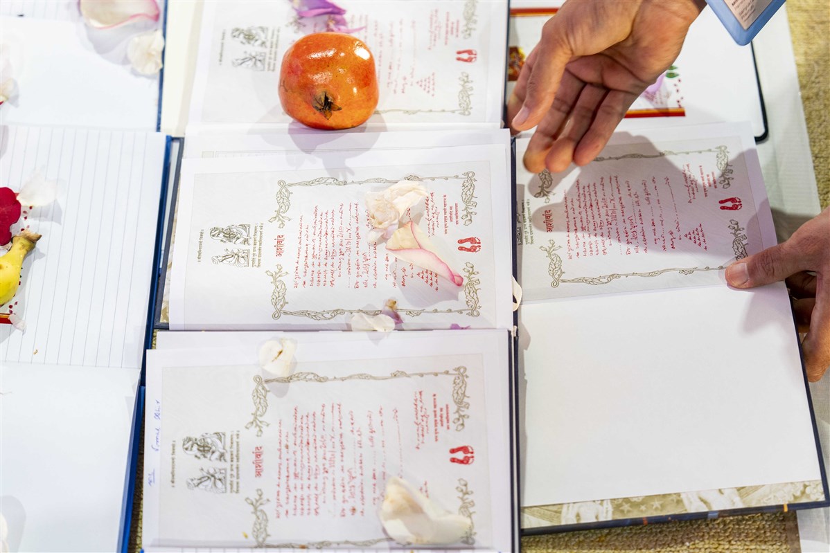 A volunteer arranges the Books for Diwali Puja