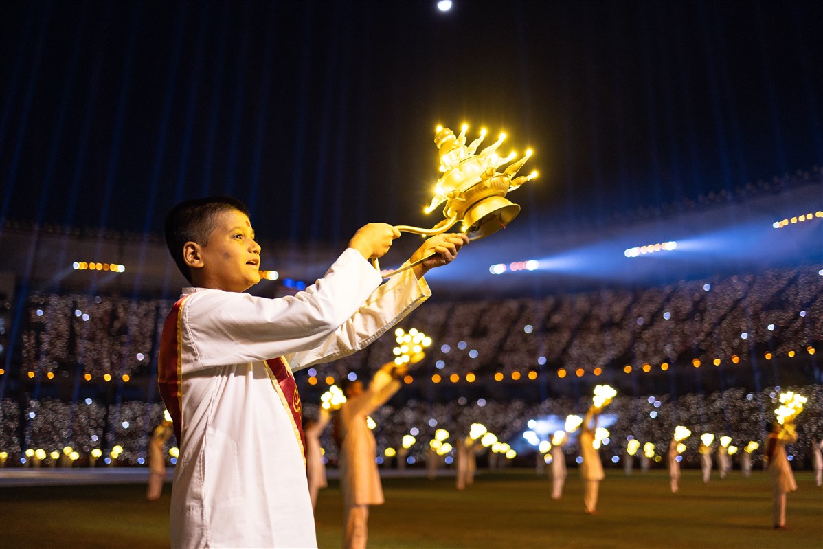 Children and youths perform the arti