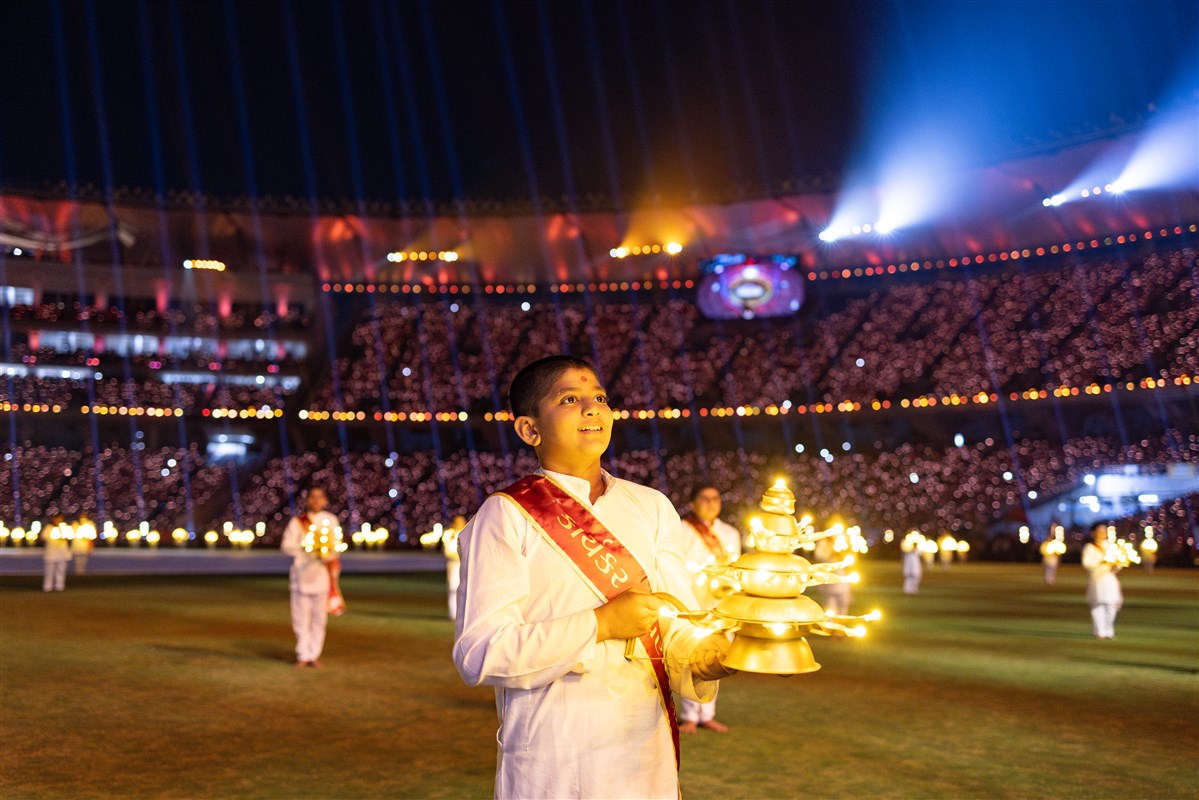 Children and youths perform the arti