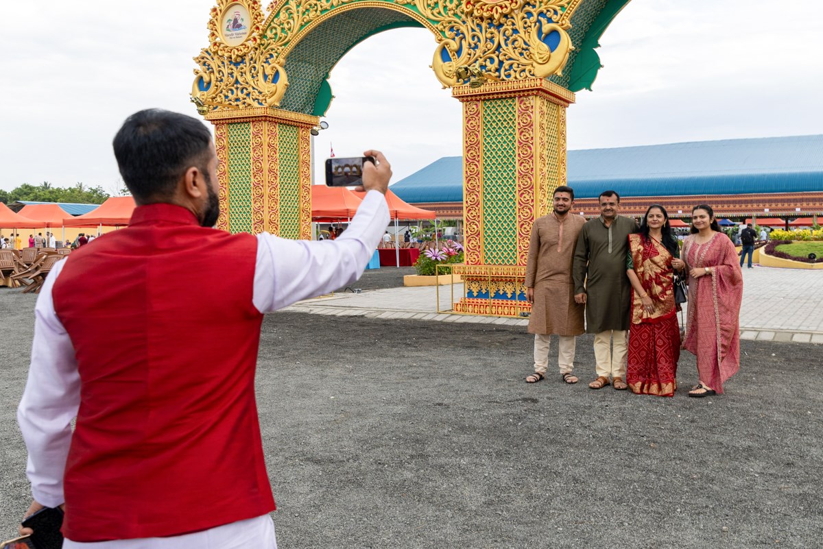 Devotees take a photo
