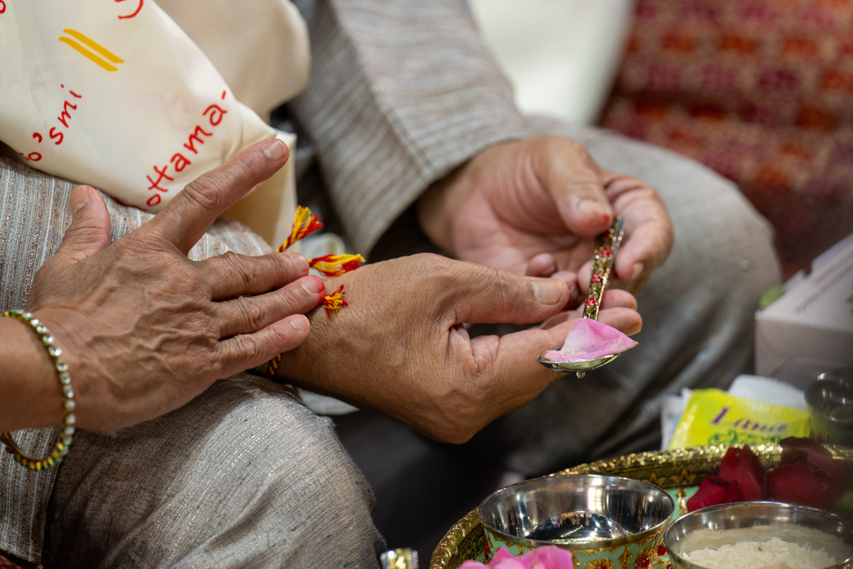 Devotees participate in the yagna rituals