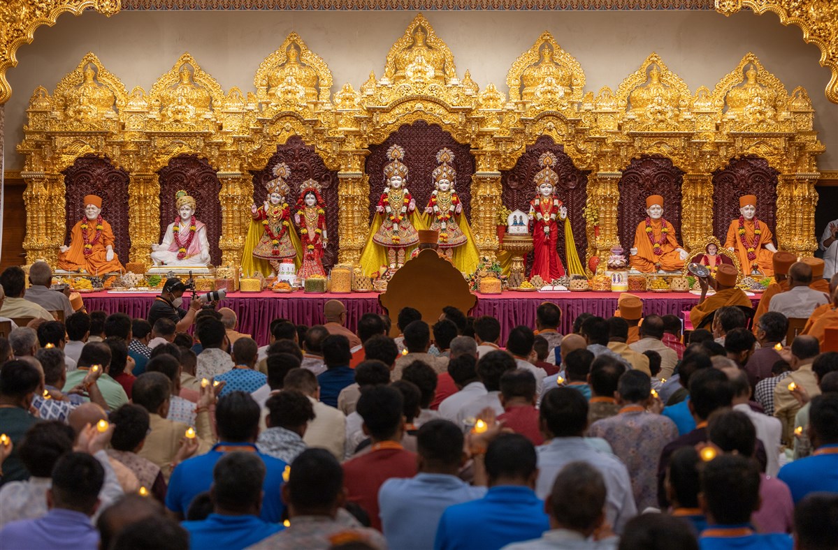 Devotees perform the arti