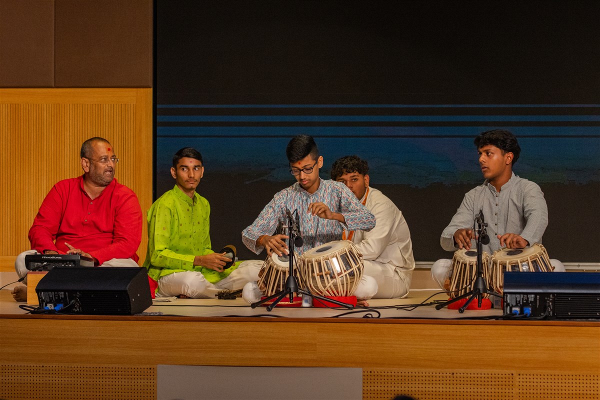 Youths play instruments in the assembly