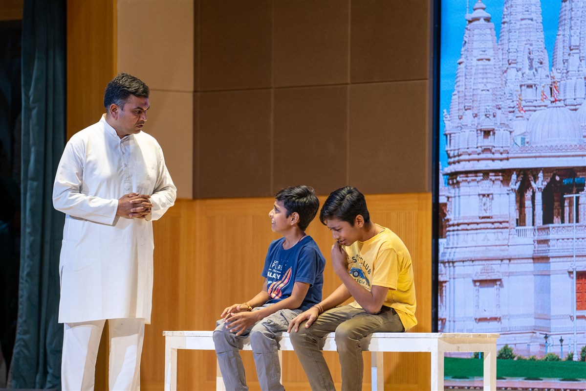 A skit presentation by a devotee and children