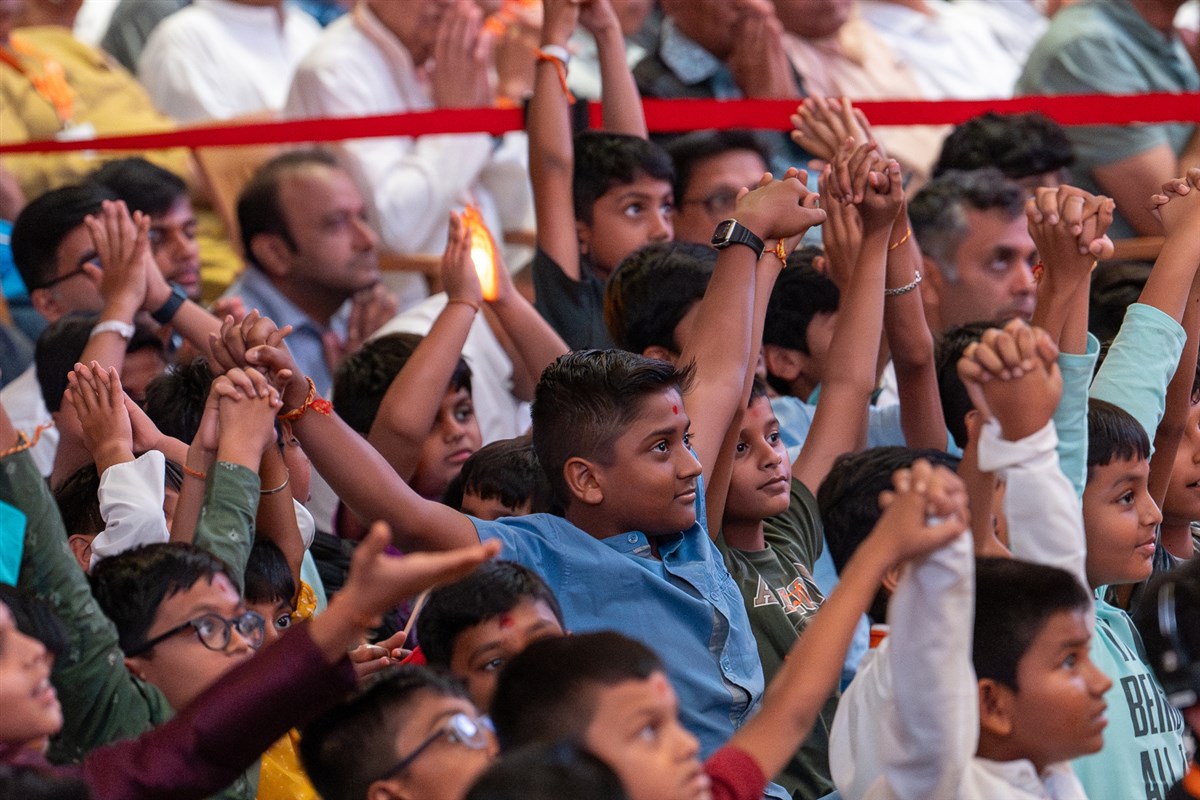 Children watch the skit performance