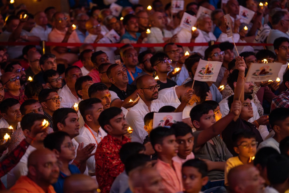 Devotees perform the arti