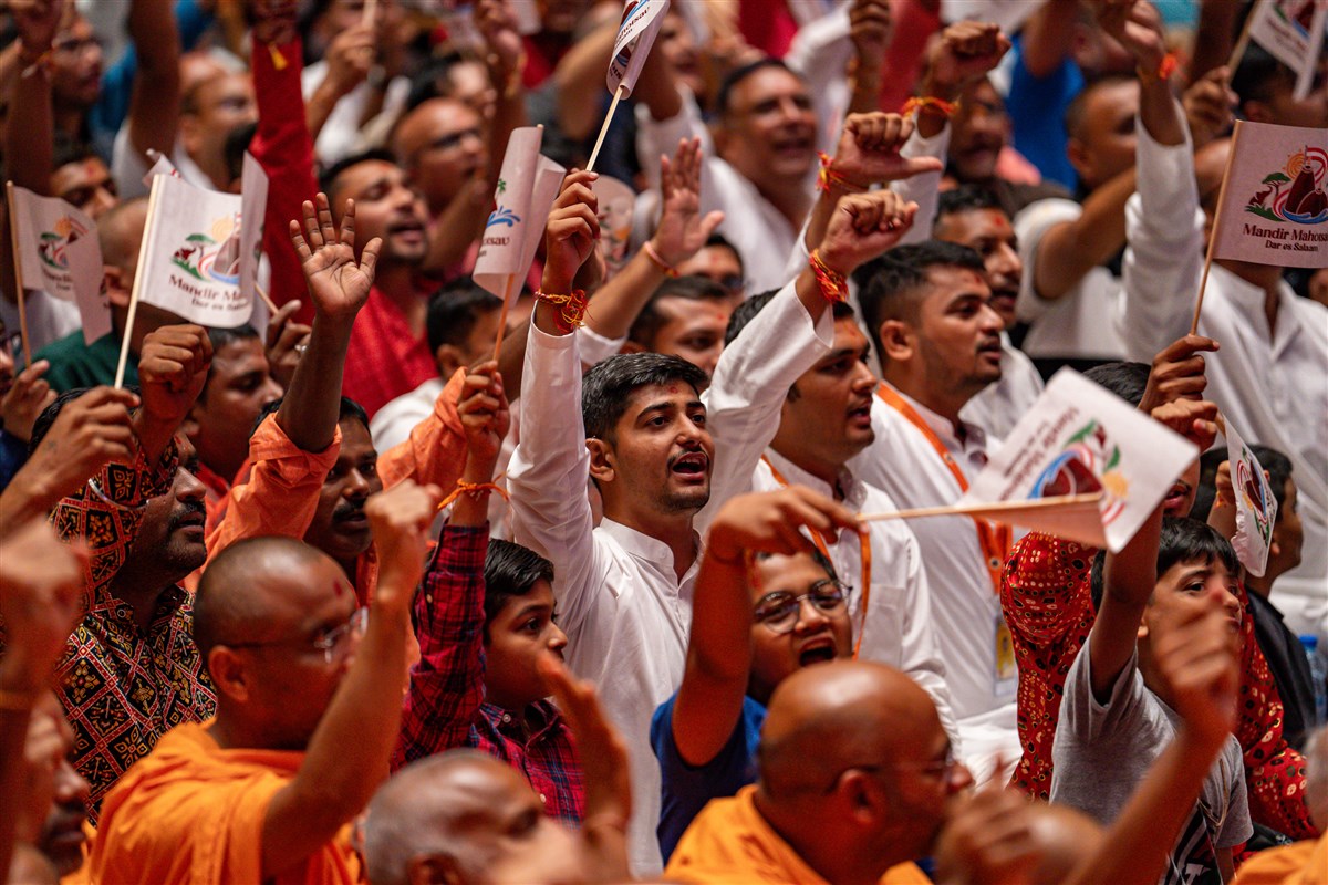 Devotees wave flags