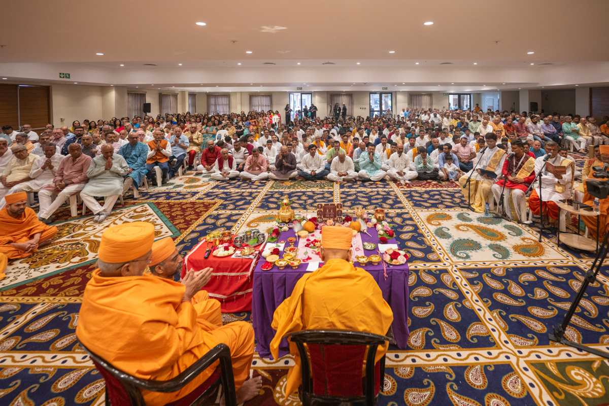 Devotees participate in the pratishtha mahapuja rituals