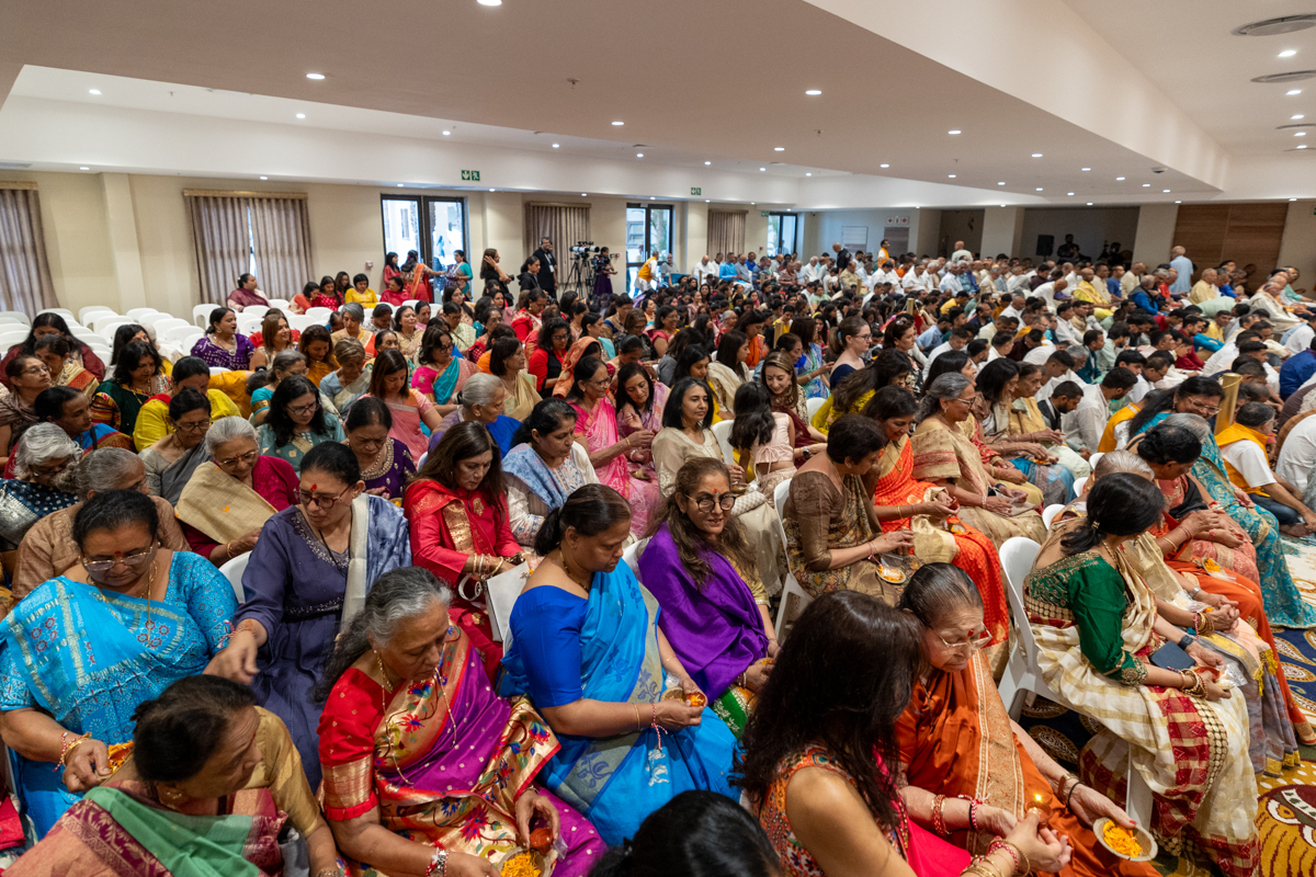 Devotees participate in the pratishtha mahapuja rituals