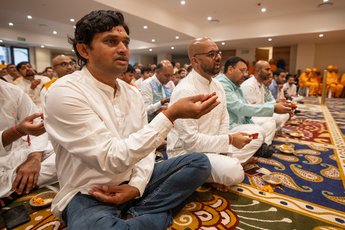 Devotees perform the arti