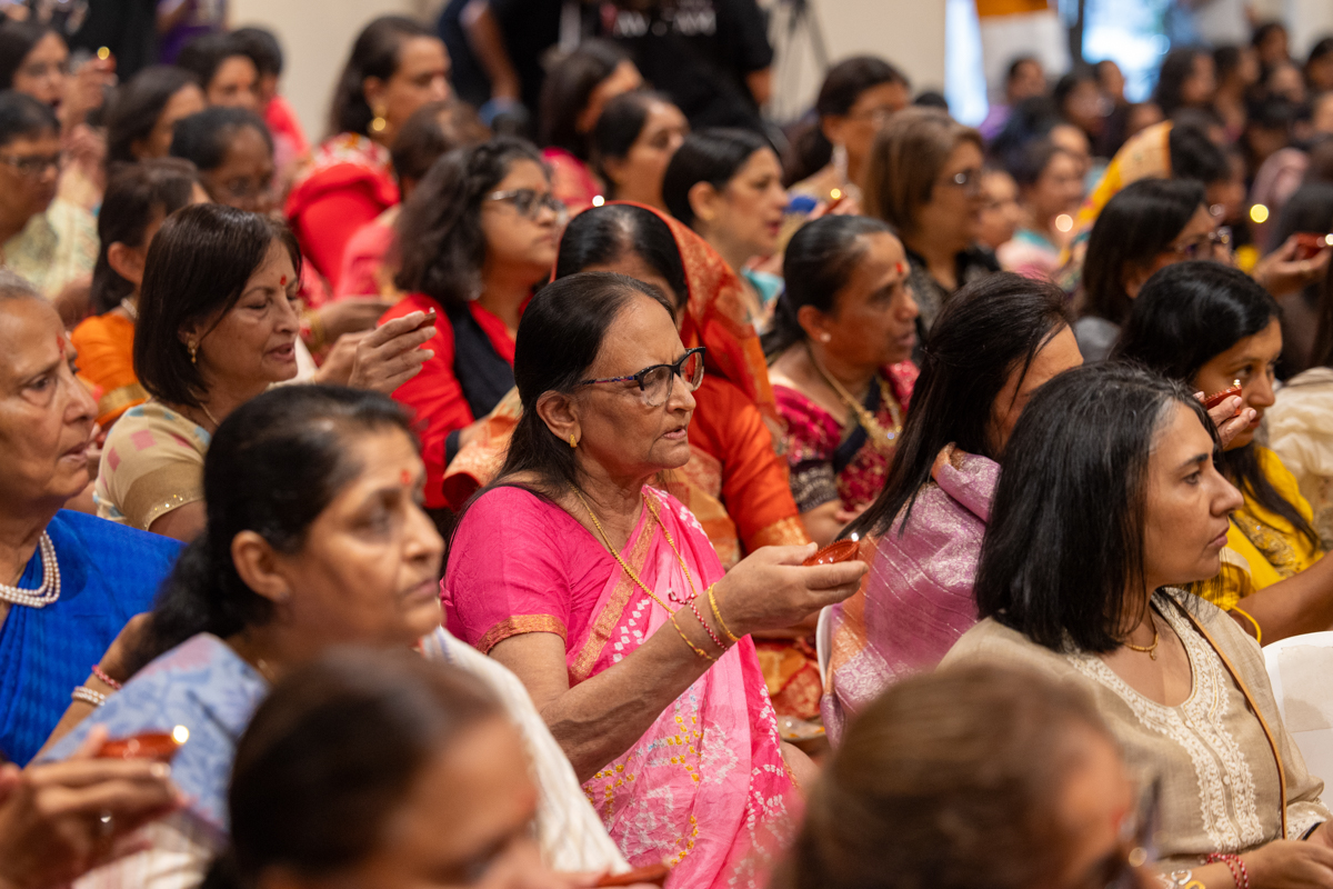 Devotees perform the arti