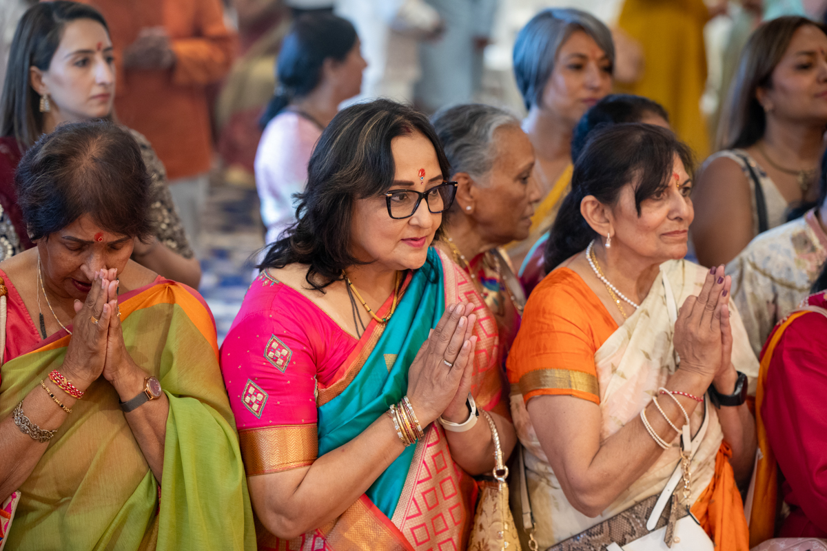 Devotees doing darshan of the murtis
