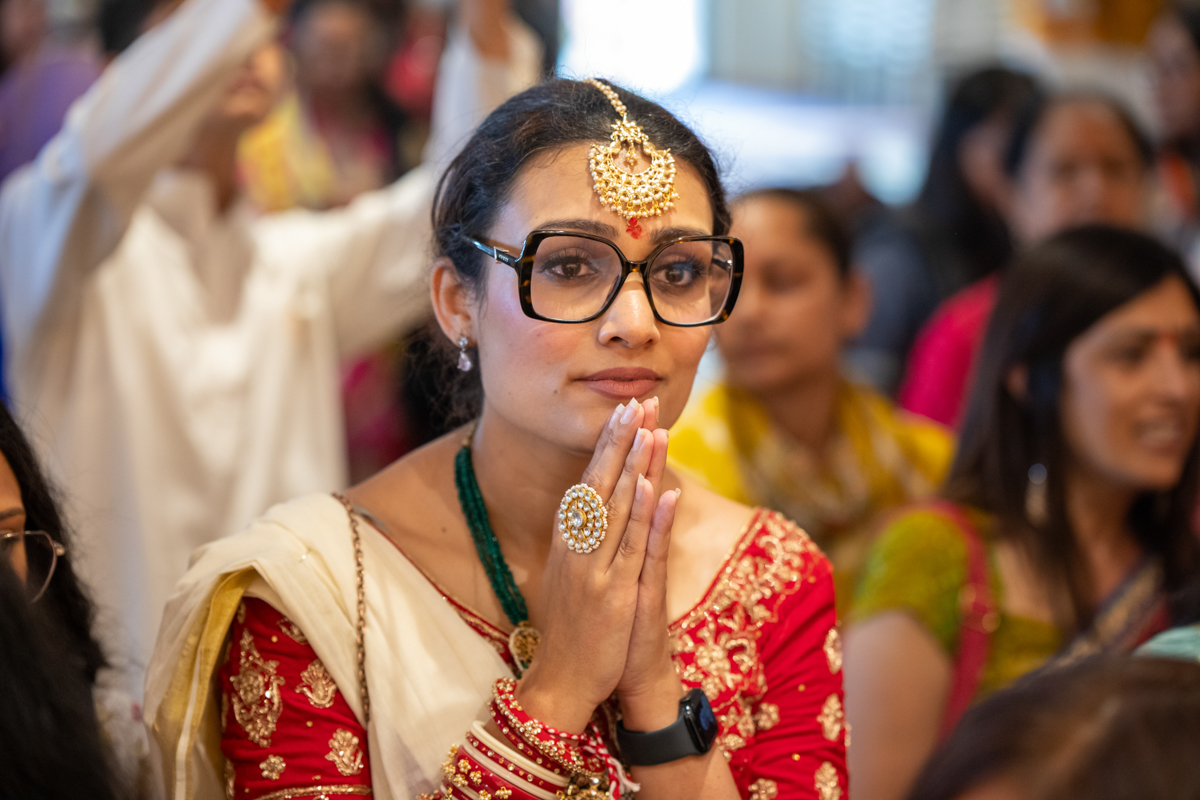 Devotees doing darshan of the murtis