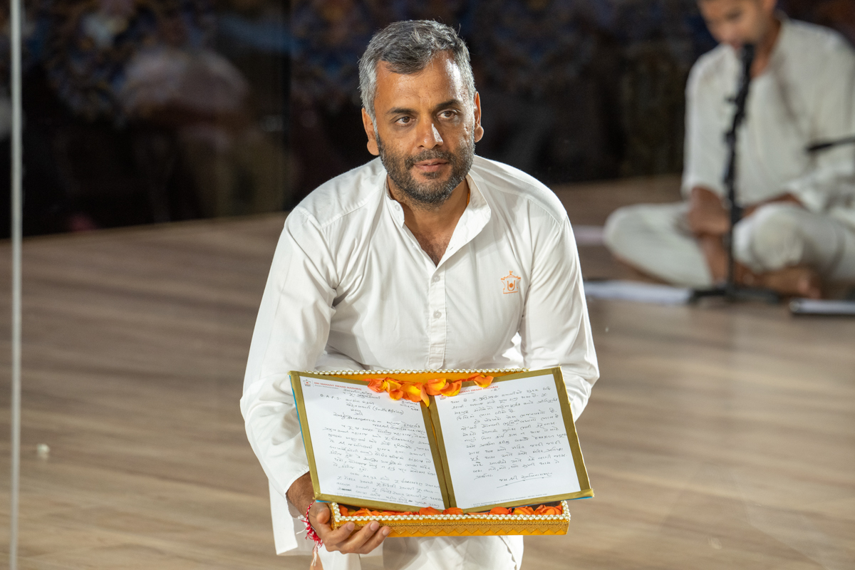 A devotee displays a letter
