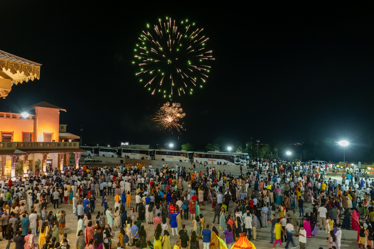 Children and devotees watch the fireworks