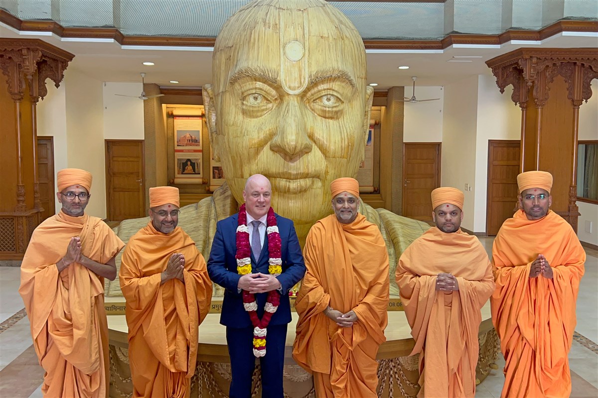 New Zealand Prime Minister Christopher Luxon with swamis