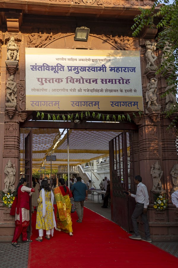 Dignitaries and devotees arrive for the book inauguration assembly