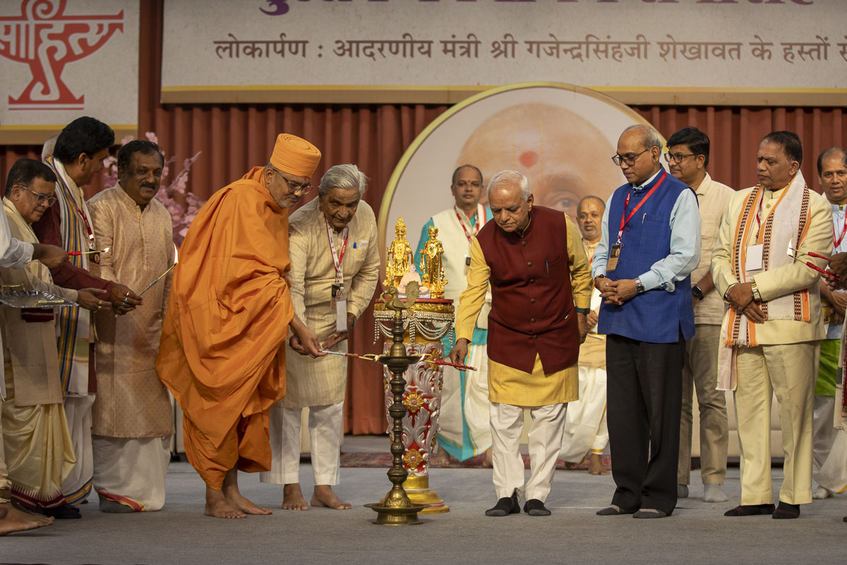 Dignitaries light the lamp