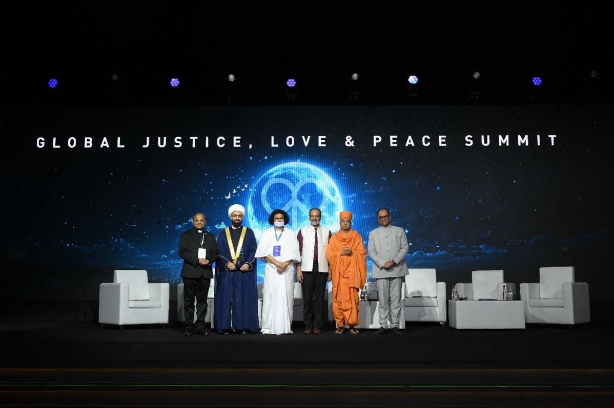 Swami Brahmaviharidas with esteemed speakers at the Global Justice, Love, and Peace Summit in Dubai