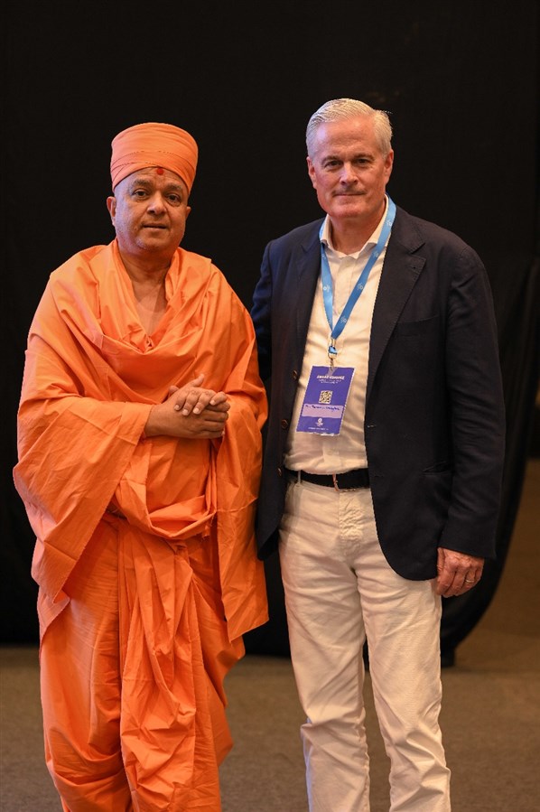 Swami Brahmaviharidas with renowned film director Tom Gallagher at the Global Justice, Love, and Peace Summit