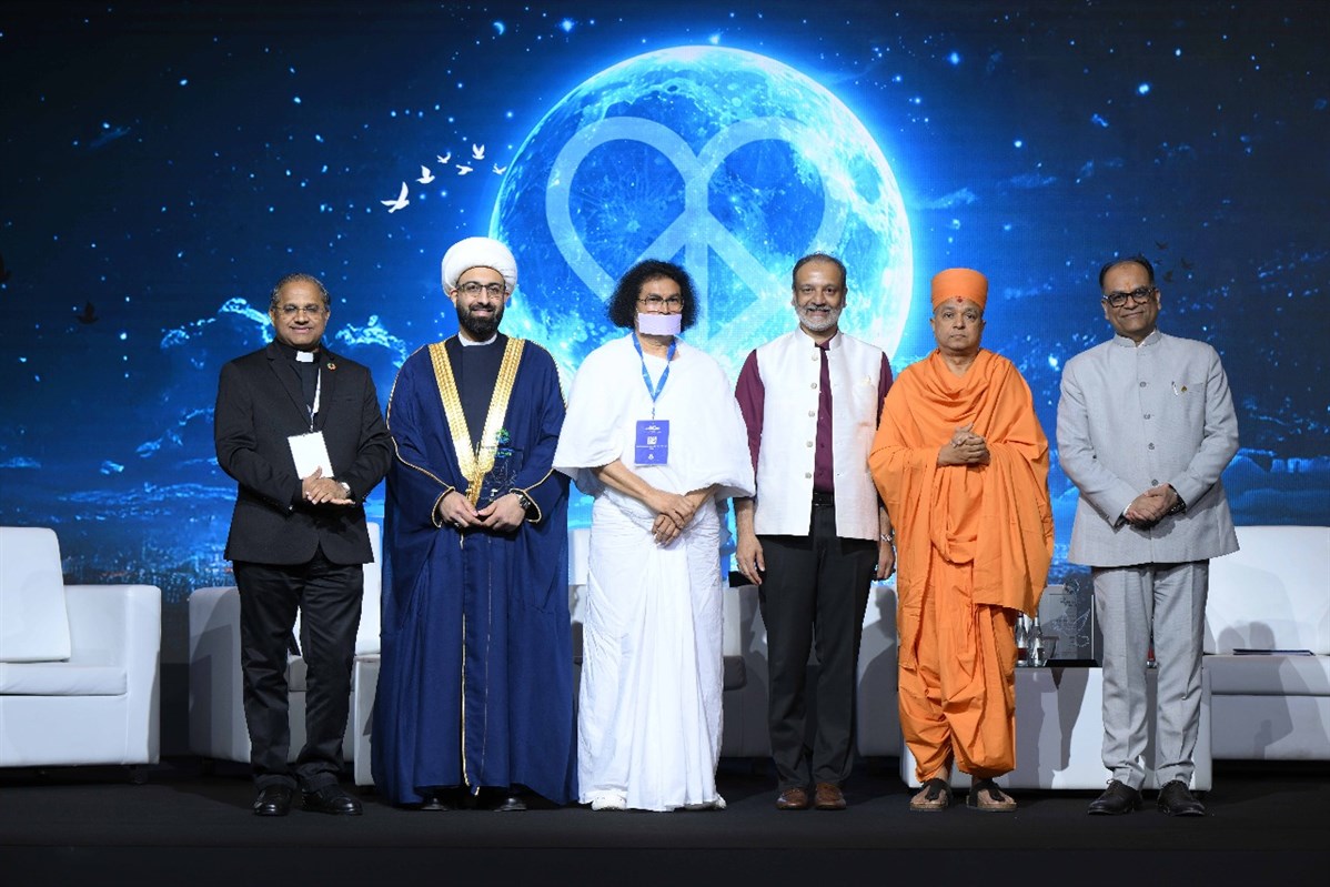 Swami Brahmaviharidas with esteemed speakers at the Global Justice, Love, and Peace Summit in Dubai