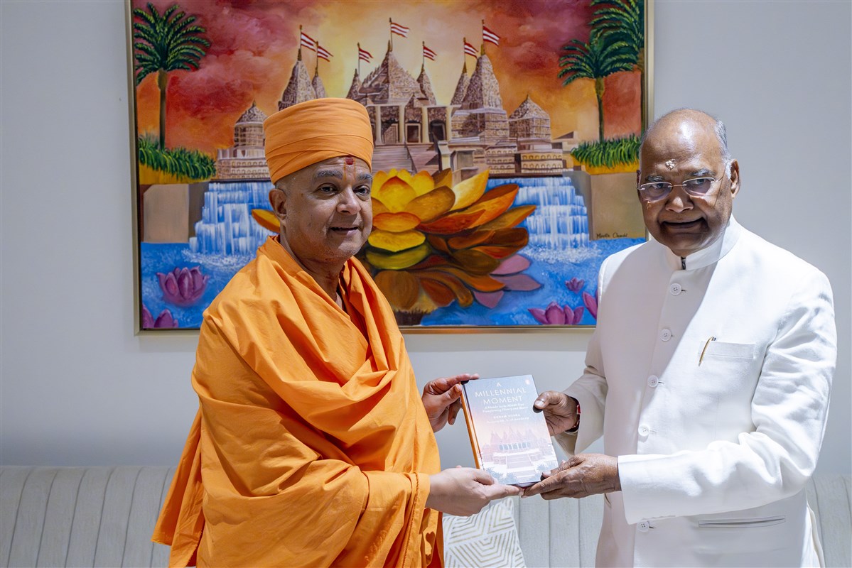 Swami Brahmaviharidas presents a copy of the book “A Millennial Moment: A Mandir in the Middle East Transforming History and Hearts” to Shri Ram Nath Kovind.