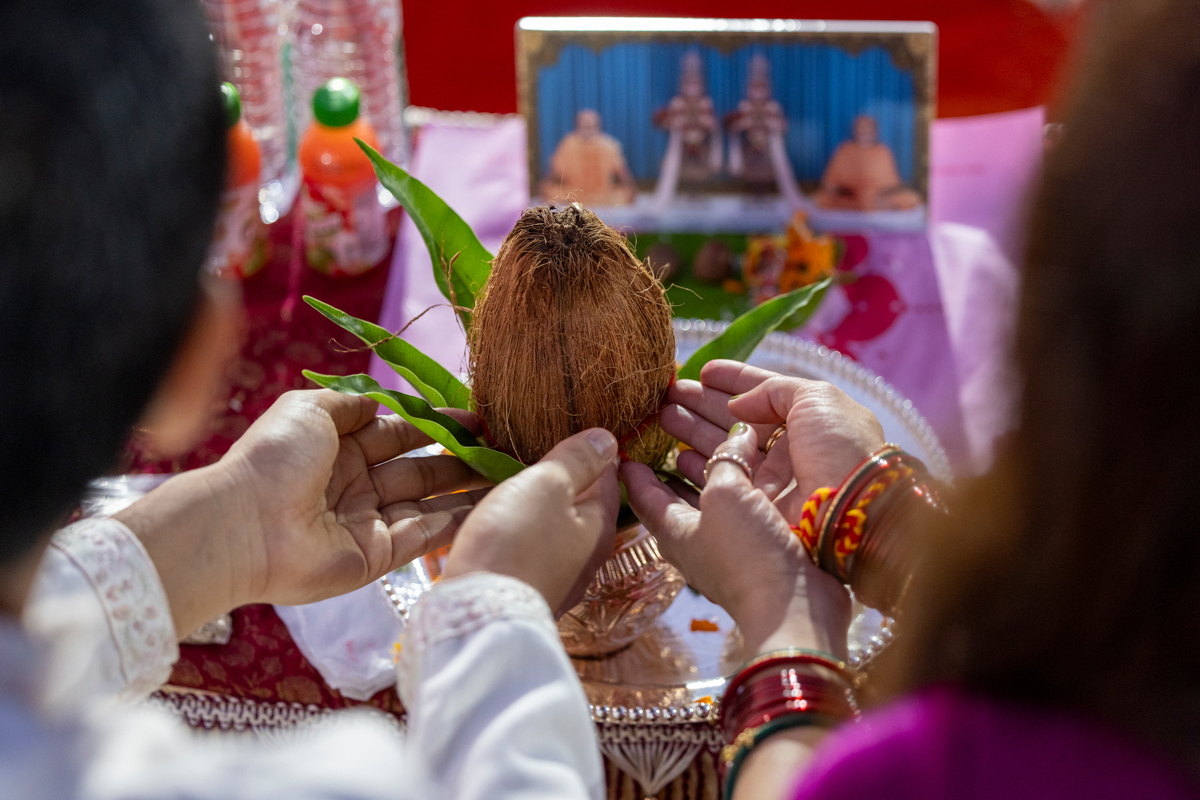 Devotees participate in the yagna rituals