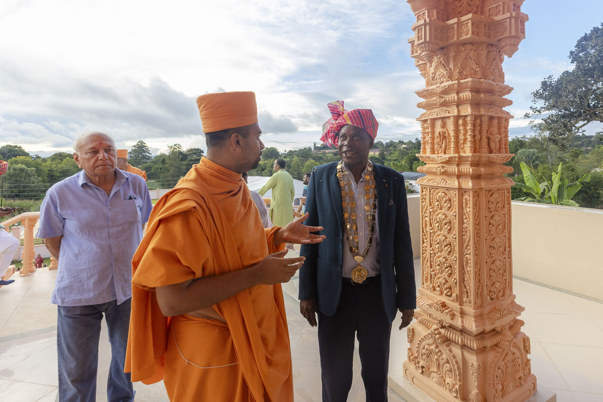 A swami in conversation with a dignitary