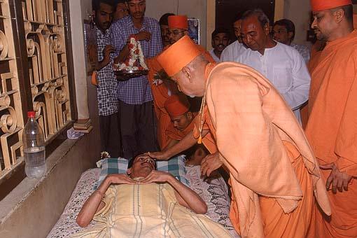 Blessing an ailing devotee 