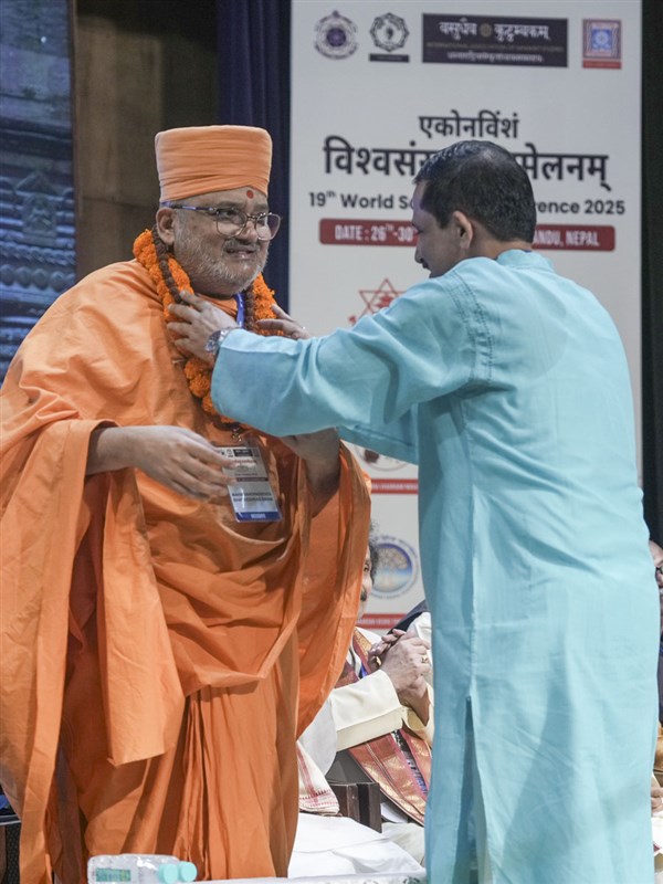 Bhadresh Swami was warmly welcomed by Prof. Kashinath Nyaupane, Chair of the 19ᵗʰ World Sanskrit Conference, during the special panel on Akshar Purushottam Darshan