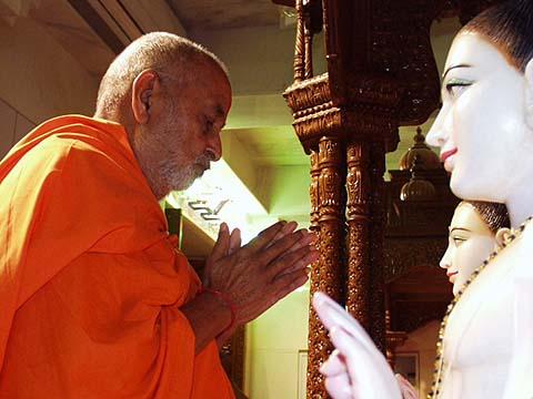 Immersed in prayers to Shri Akshar Purushottam Maharaj  	