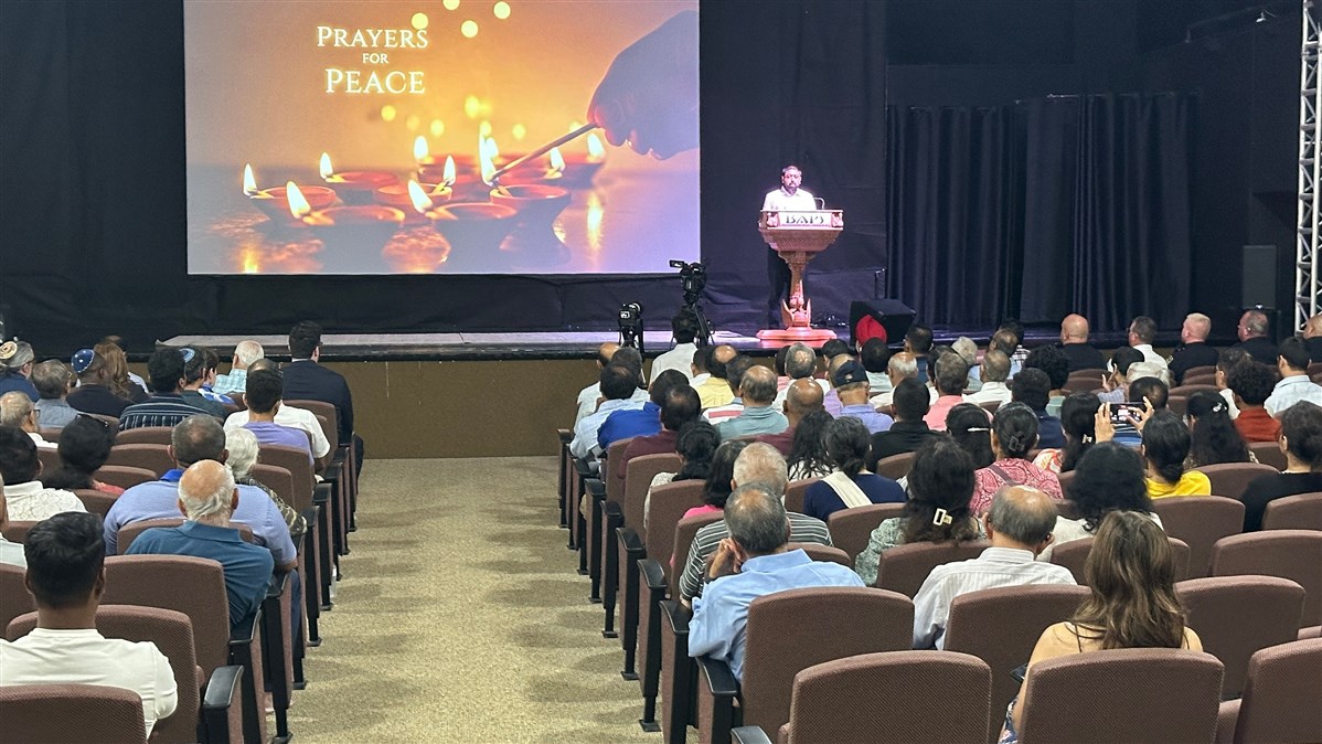 A volunteer of BAPS Shri Swaminarayan Mandir, Greenwood, IN, leads the prayer assembly.