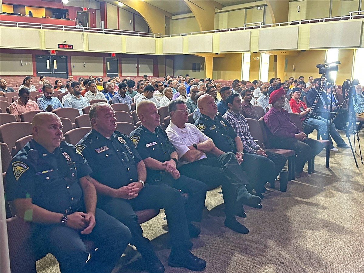 Members of the Greenwood Police Department join community members in solidarity during the prayer assembly.