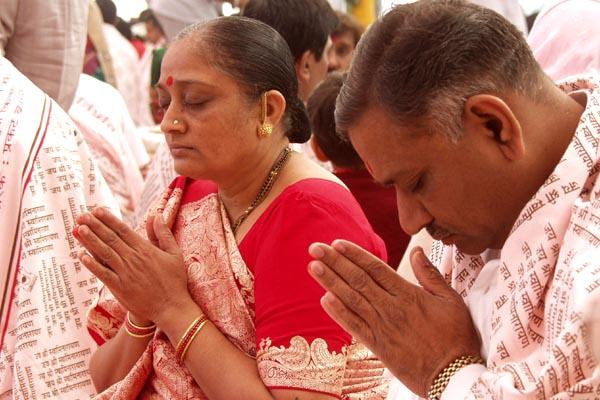 Devotees perform yagna rituals