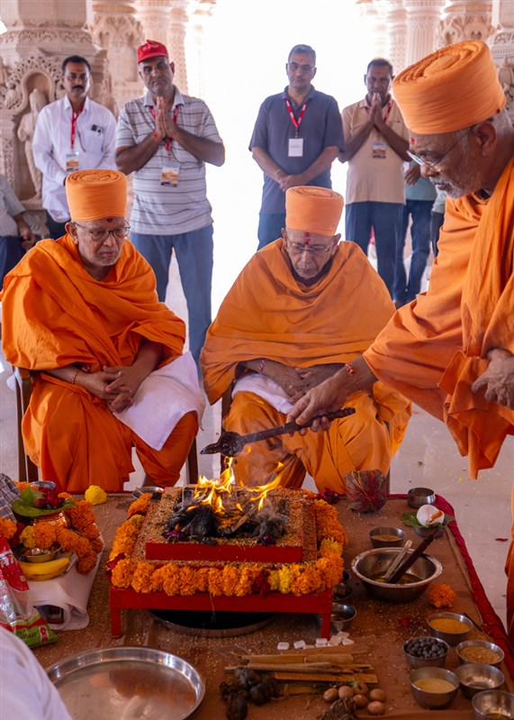 Senior swamis and devotees during the vastu pujan rituals