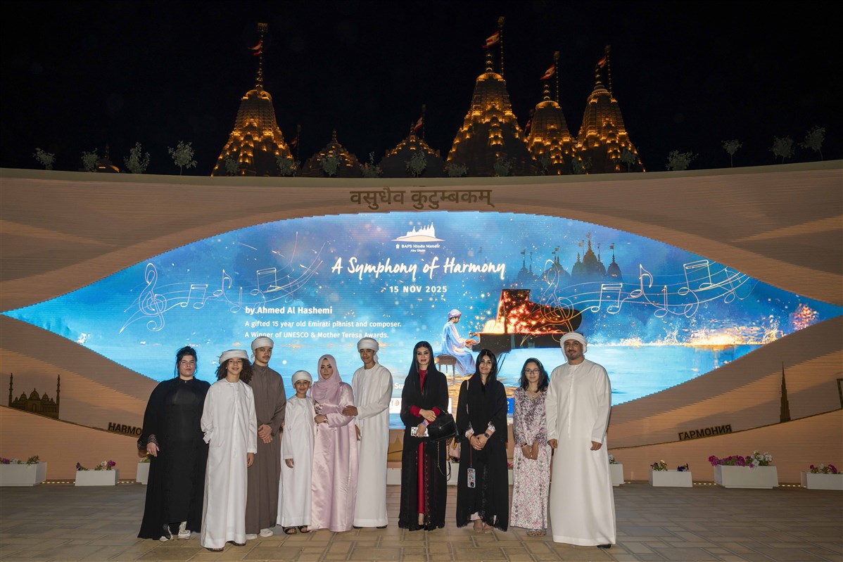 Ahmed takes a photo with his family, celebrating the Mandir as a place that enriches the human spirit inspiring People of Determination and all who visit.