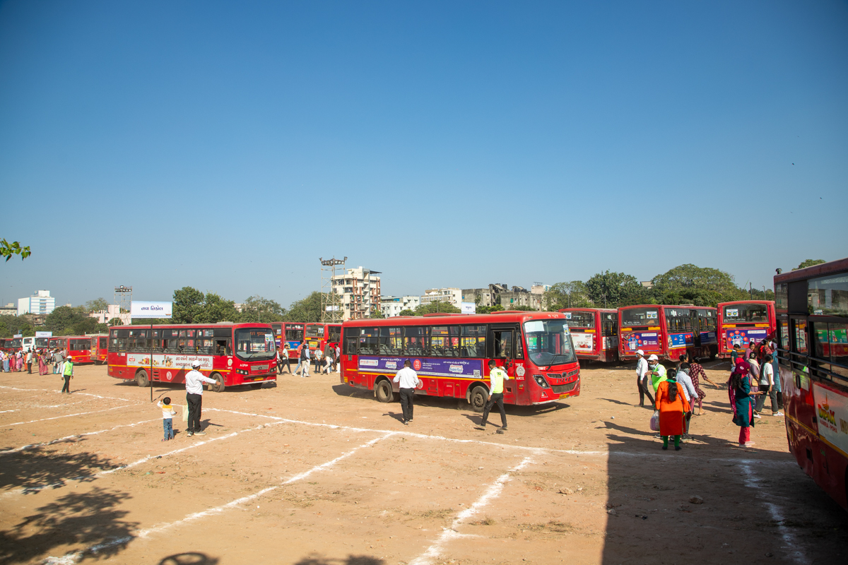 Buses arrive in the parking area